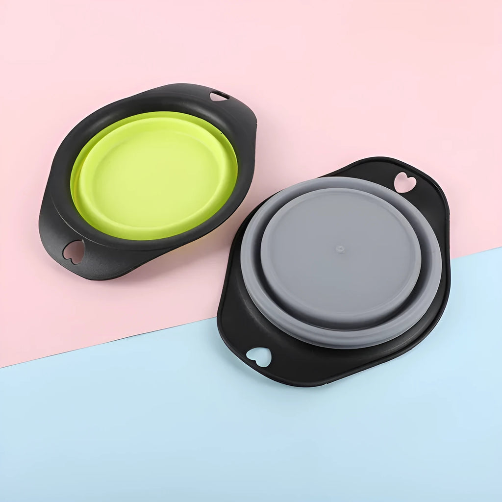 Silicone folding bowl for pets in black and green, collapsed flat for storage, portable outdoor cat and dog food bowl