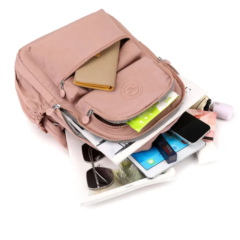 Women's large capacity multi-layer travel backpack in Zhu Mo Black, made from waterproof nylon