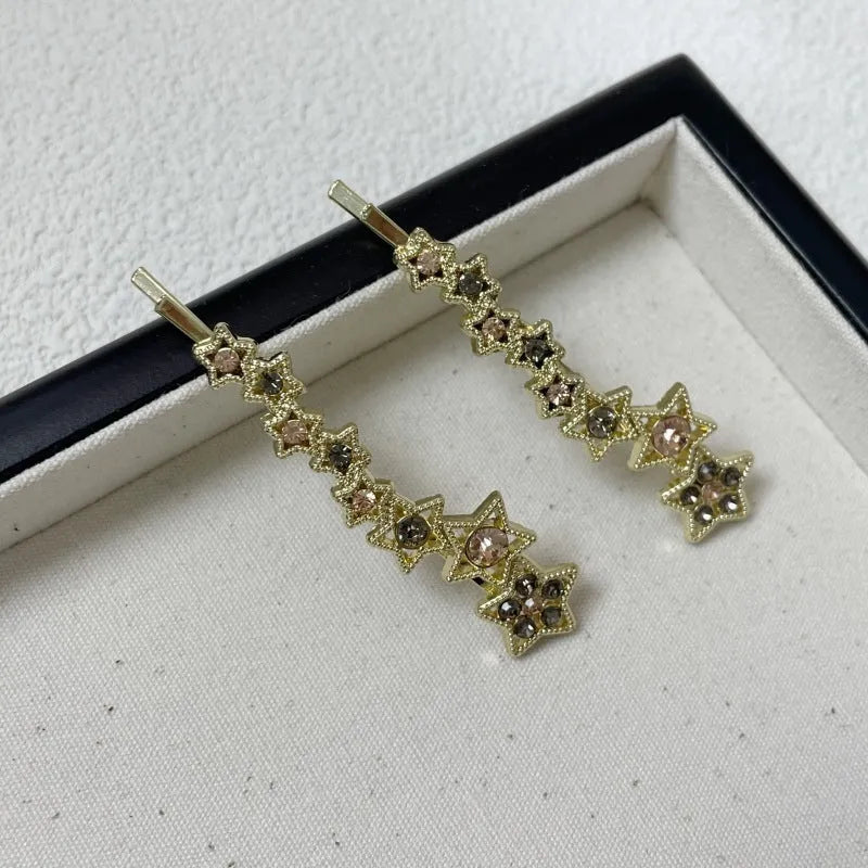 Gold electroplated alloy barrette clip with five-pointed star rhinestone design for bangs and hair sections
