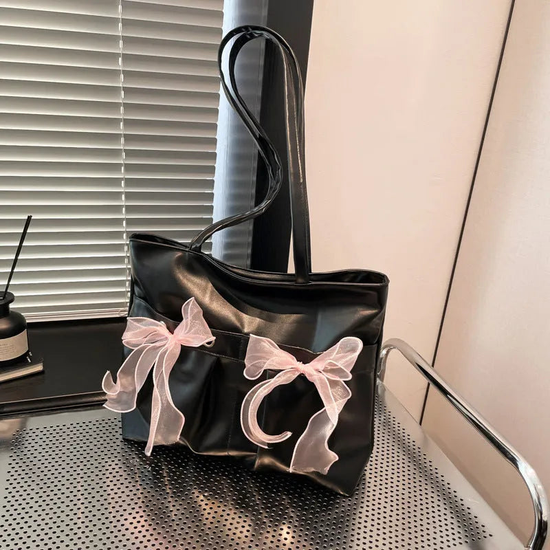 College style bow tote bag in black with large capacity, double shoulder straps, and zipper closure