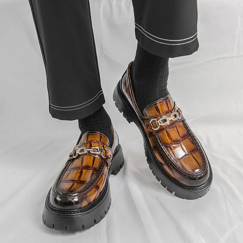 Pair of autumn men's crocodile pattern leather loafers in brown with flat heel platform sole