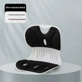 Solid colour memory foam lumbar support cushion on a chair, shown in grey.