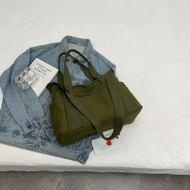 Large capacity shoulder canvas tote bag in solid colour with external sandwich pocket