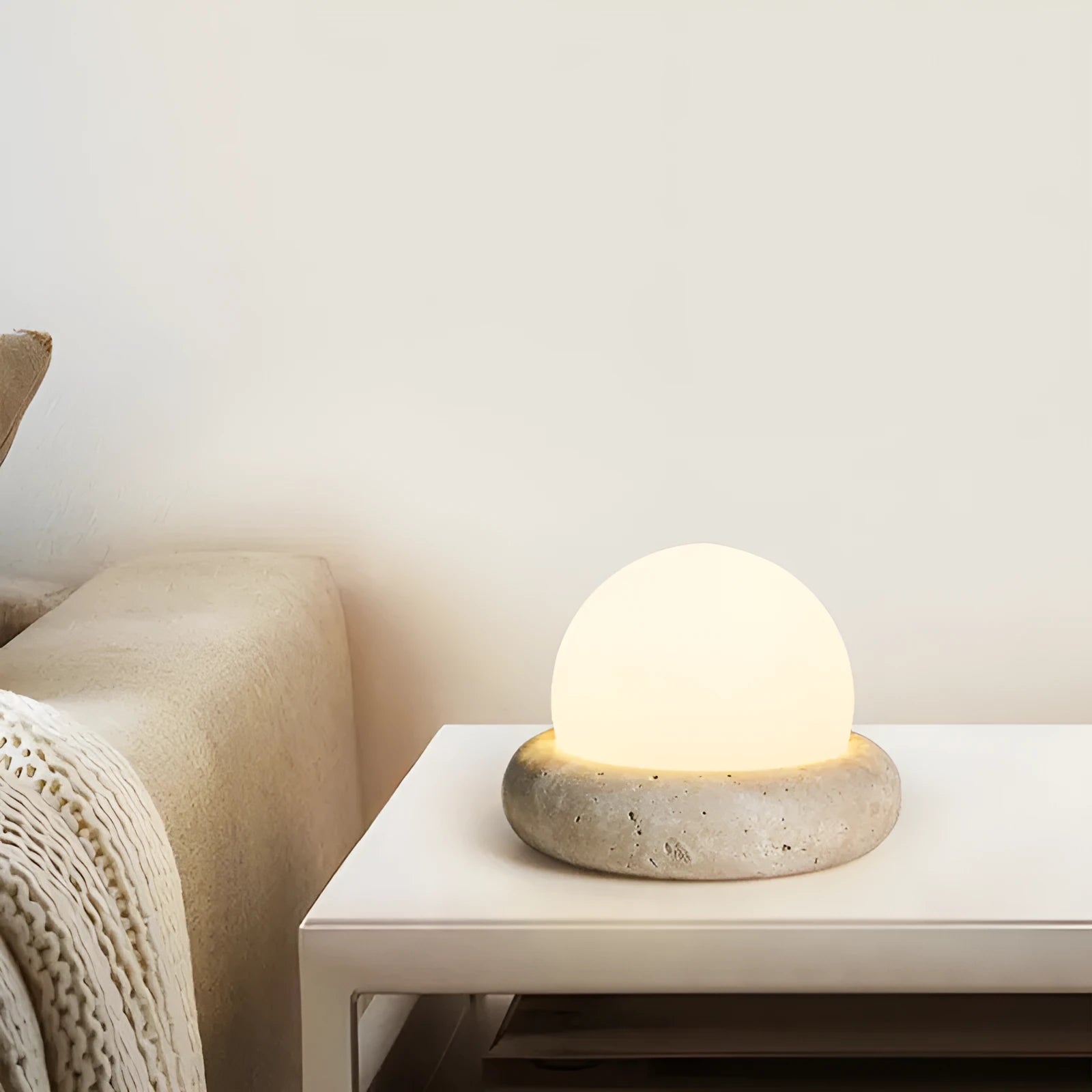 Cream modern bedside night lamp with remote control on wooden nightstand