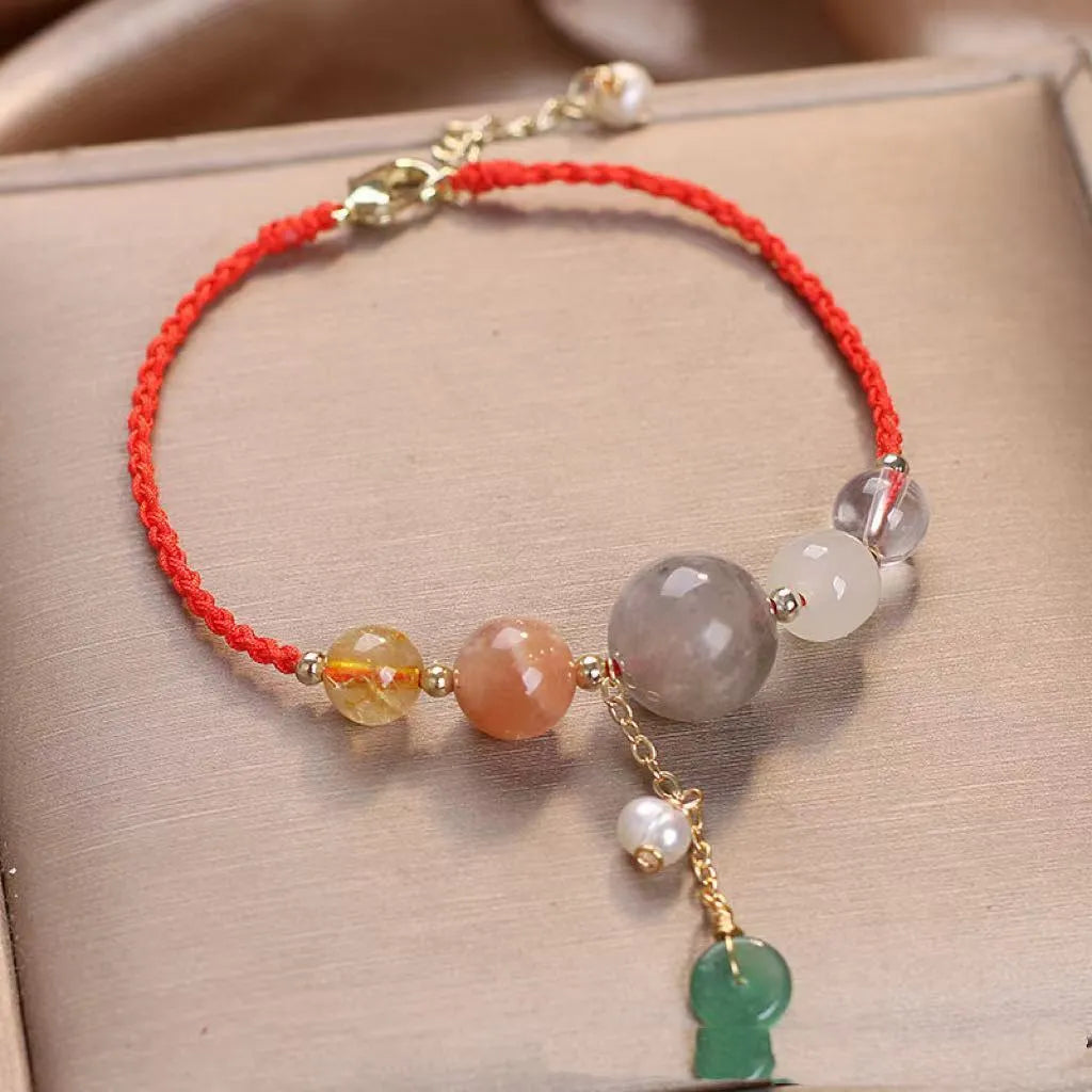 Hand-woven peace buckle bracelet with crystal and sequin details in red, green, and blue colour options for women