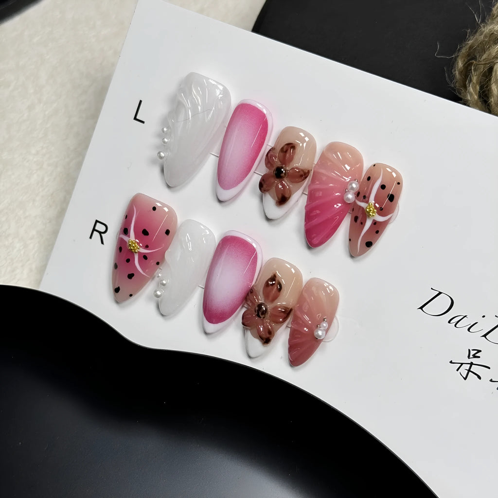 Hand-painted 3D nail patches with embossed candy patterns in almond shape on plastic armour suit