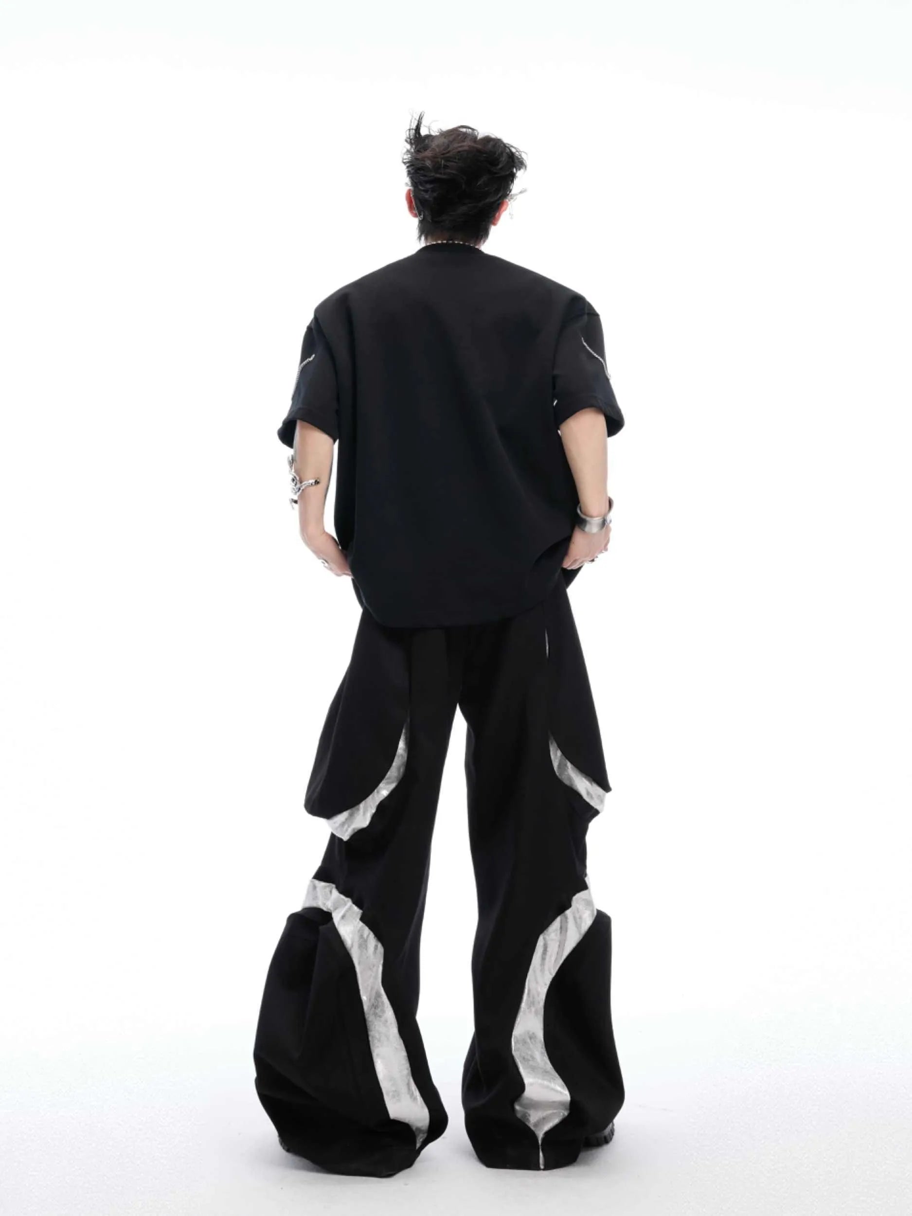 Black short sleeve T-shirt with metal chain detail on padded shoulders, round neck, heavy cotton fabric