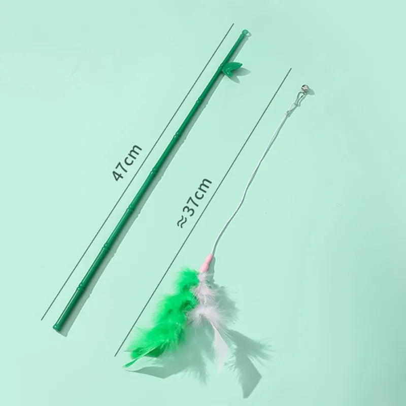 Green interactive cat toy feather wand with bell refills and feathers on a white background