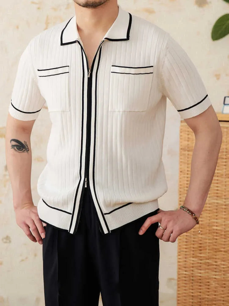 Slim fit black short-sleeved polo shirt with a lapel collar, made from a viscose and polyester knit fabric.