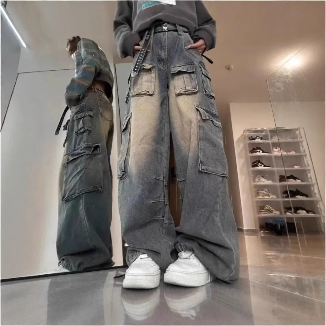 Loose fit multi-pocket distressed denim jeans in light blue wash straight-leg street style