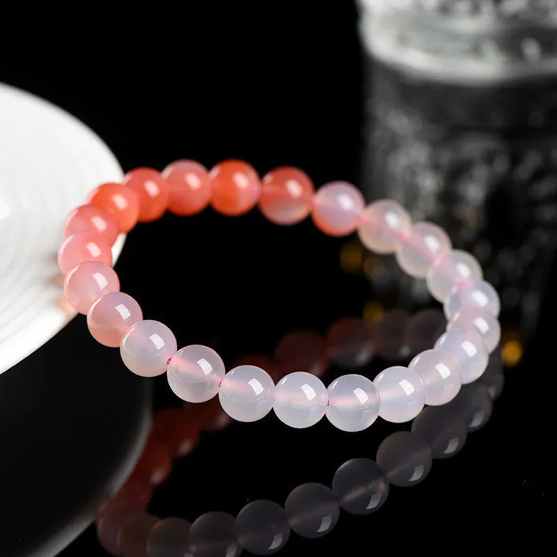 Natural gradient Yanyuan agate bracelet with geometric beads in four size options.