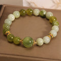 Women's bracelet in Xiuyan jade green with original design on display