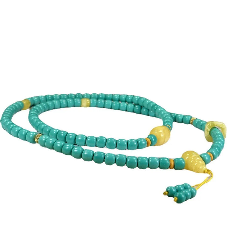 Turquoise stone lucky pendant necklace with hand-woven mesh flower design on a ball bead chain.