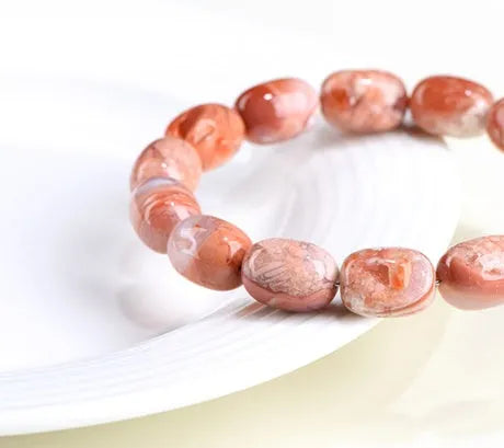 Natural cherry blossom agate bracelet with 10x14mm barrel beads and Ruyi geometric design elements