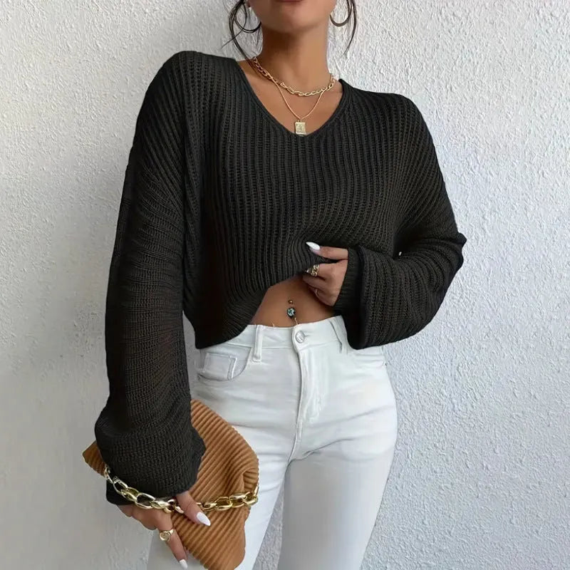 Women's solid colour long sleeve pullover in a loose casual fit, shown in one of five colour options.