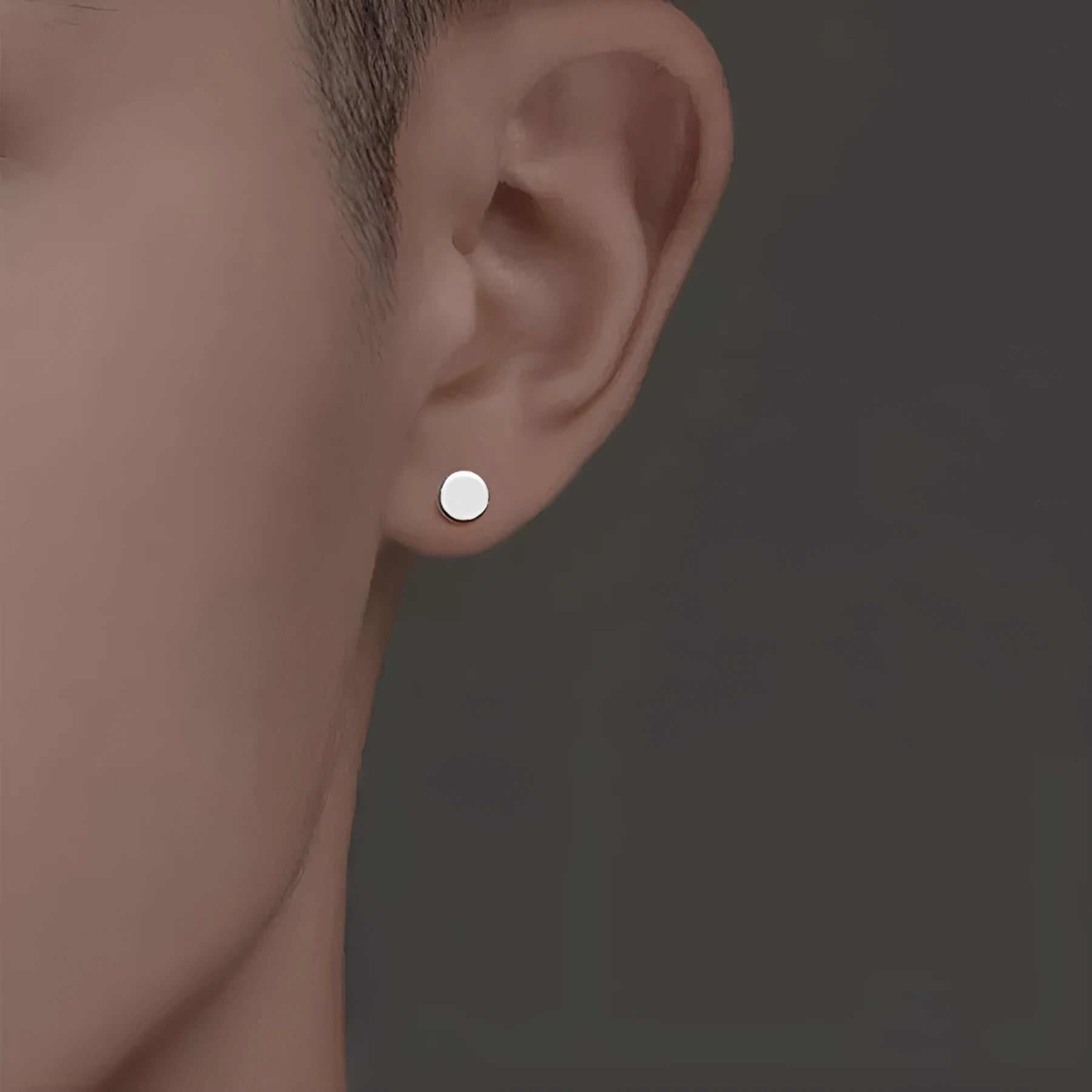 A pair of simple round flat S999 Sterling Silver ear bone studs for cartilage piercing.