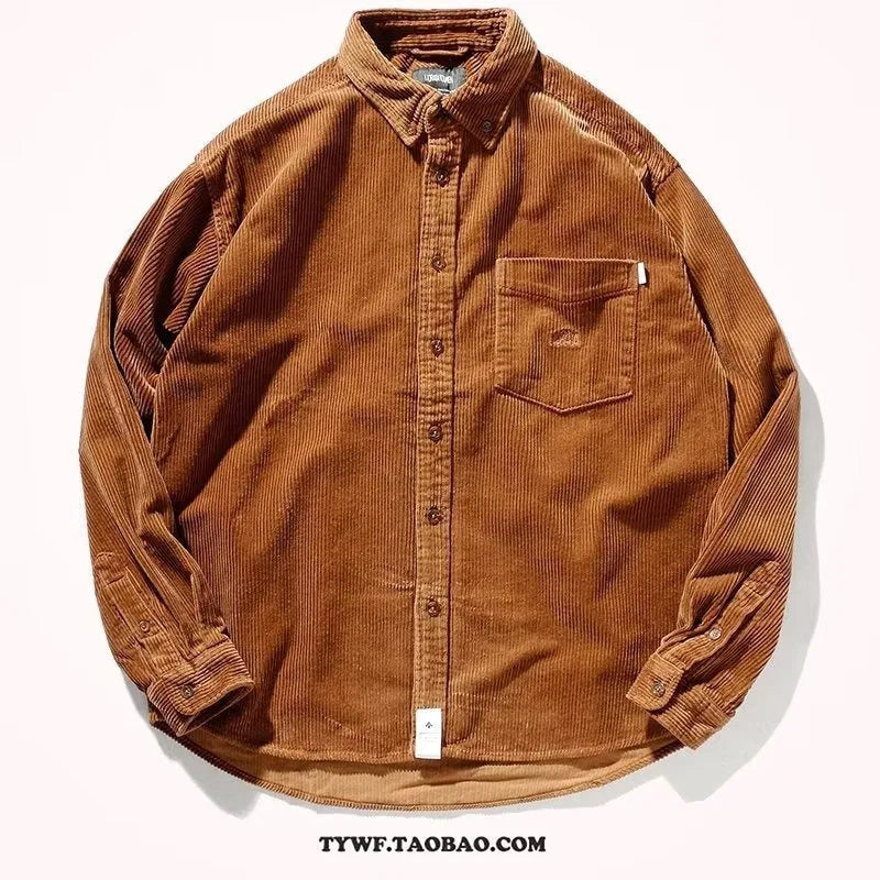 Loose long sleeve corduroy shirt in caramel colour, cardigan style, laid flat.