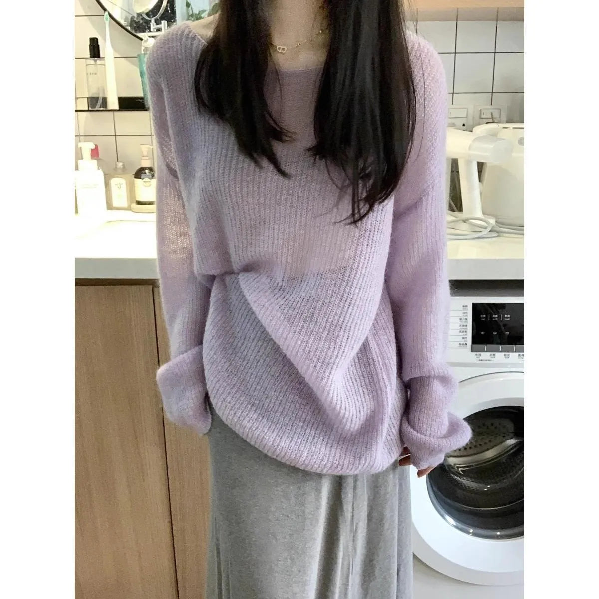 Purple loose-fitting women's blouse made of ice silk with sleeveless princess sleeves.