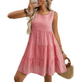 Women's loose-fitting sleeveless plaid dress with a high waist and midi-length swing skirt.