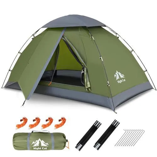Dark green automatic pop-up two-person camping tent with dome shape shown set up in outdoor environment