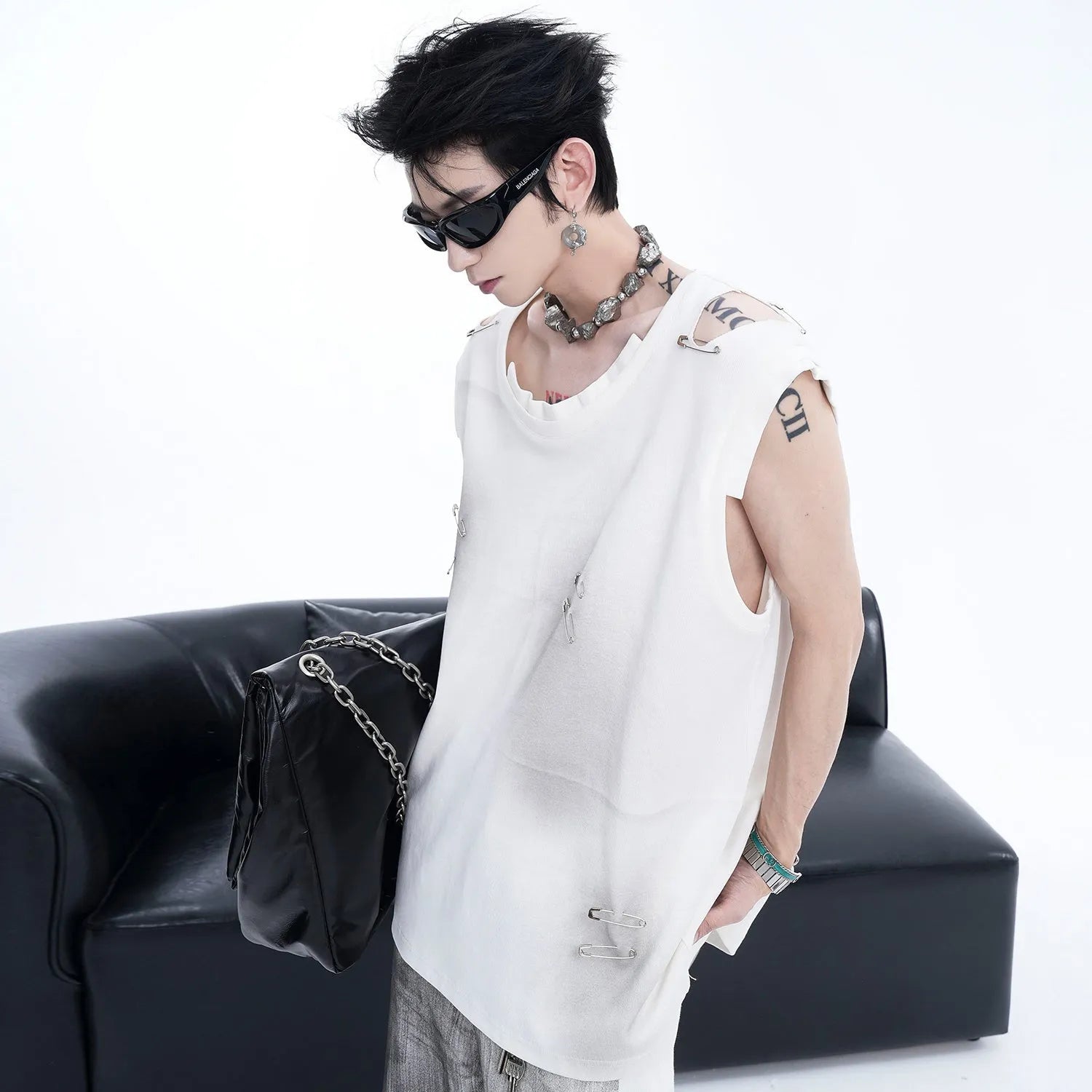 Black men's sleeveless vest with ripped irregular cut design and round neck collar.