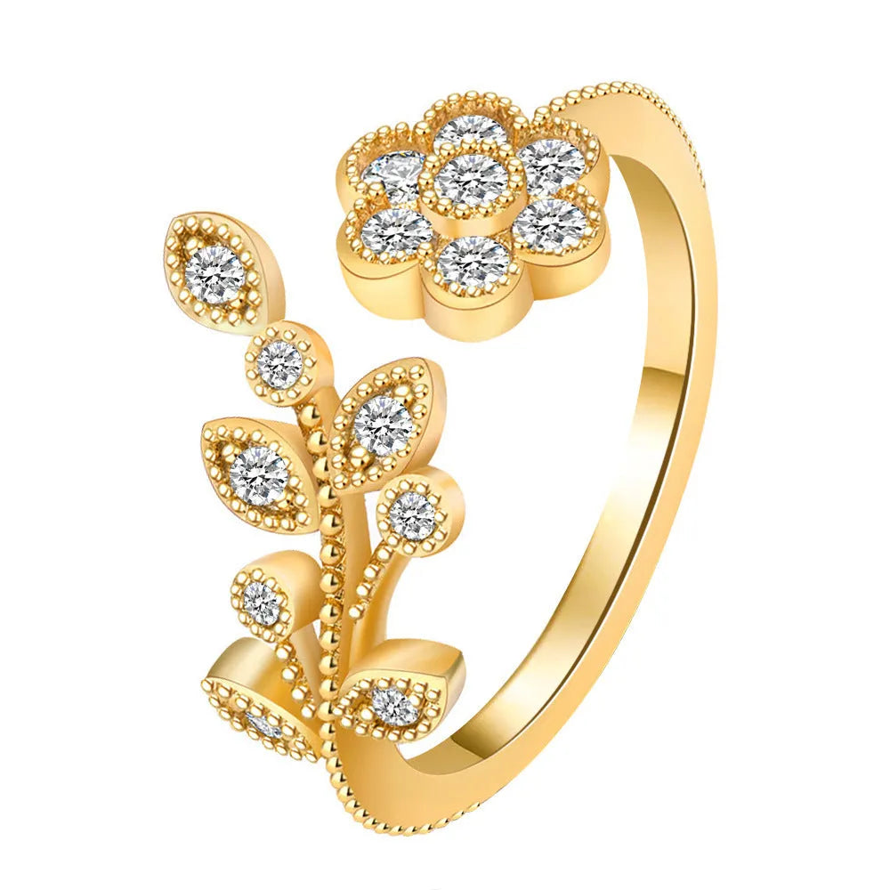 Open mouth copper ring with flower and leaf design in gold finish