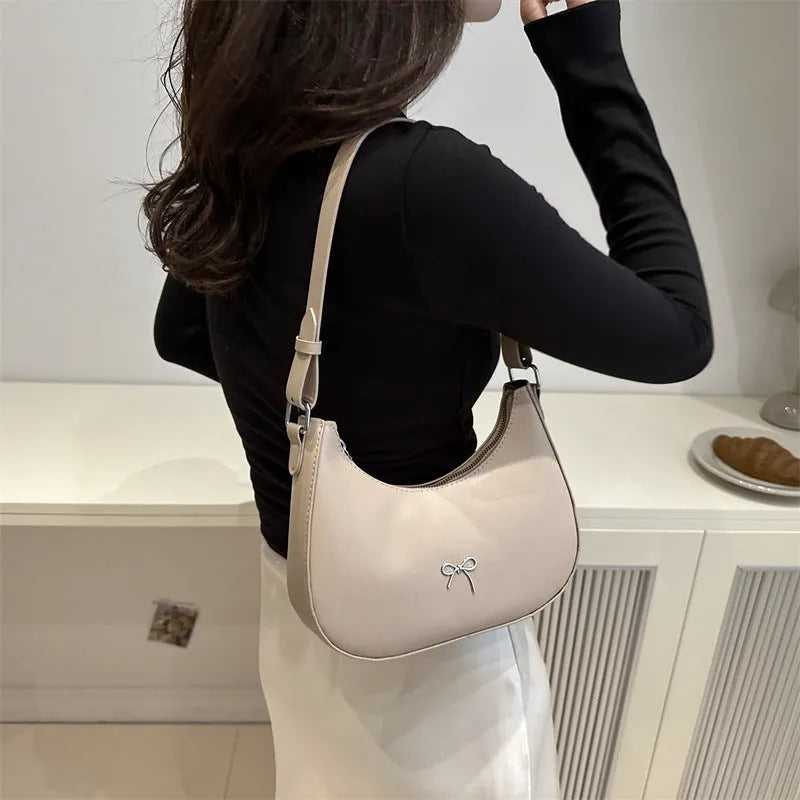 Women's underarm baguette handbag in PU material, dumpling shape, with sewing thread detailing, six colour options