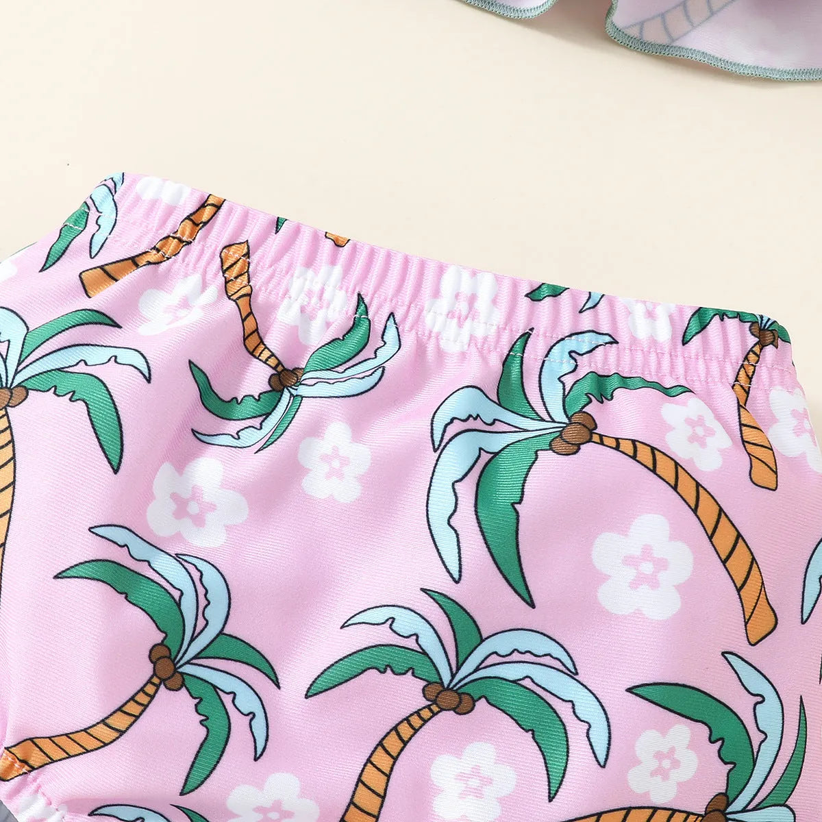 White children's two-piece swimsuit set with shirt and shorts on hanger