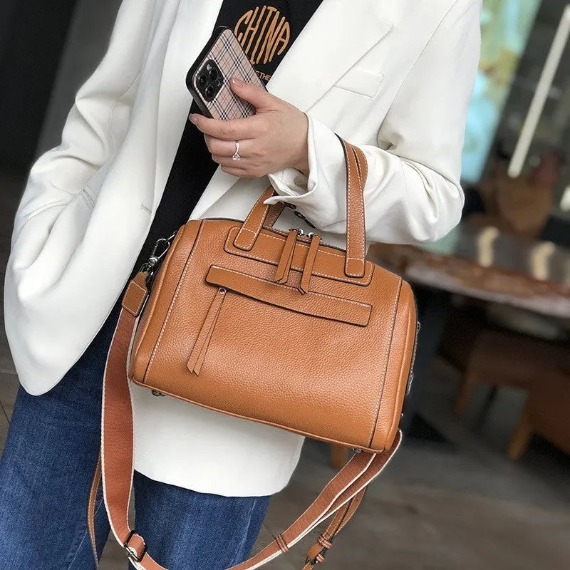 Genuine leather shoulder messenger bag with litchi pattern texture in a horizontal square shape.