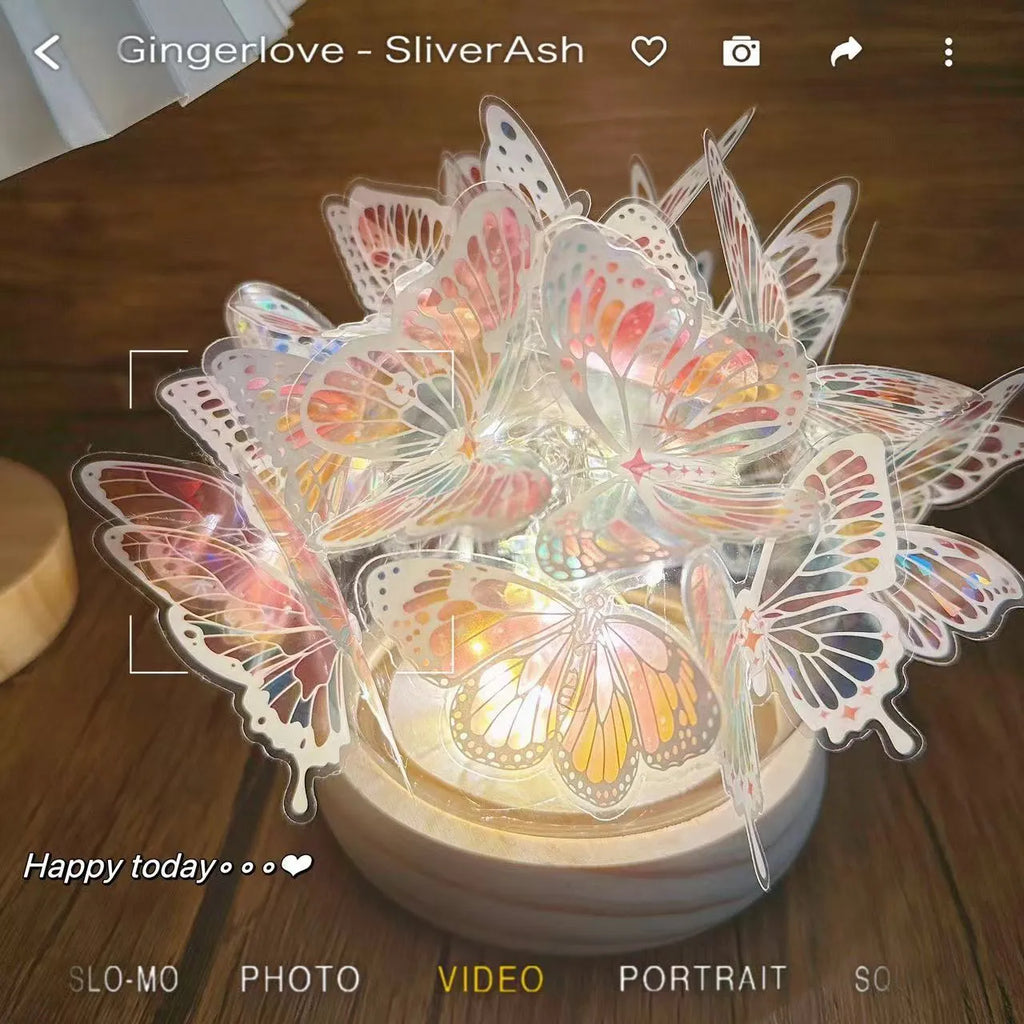 Butterfly night light with glass shade on raw wood base, measuring 12x15cm
