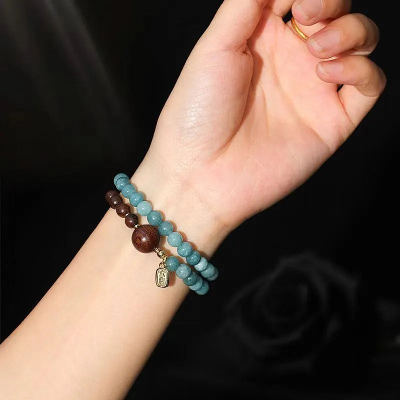 Blue gold sandalwood beaded bracelet for women with fu character charm electroplated finish
