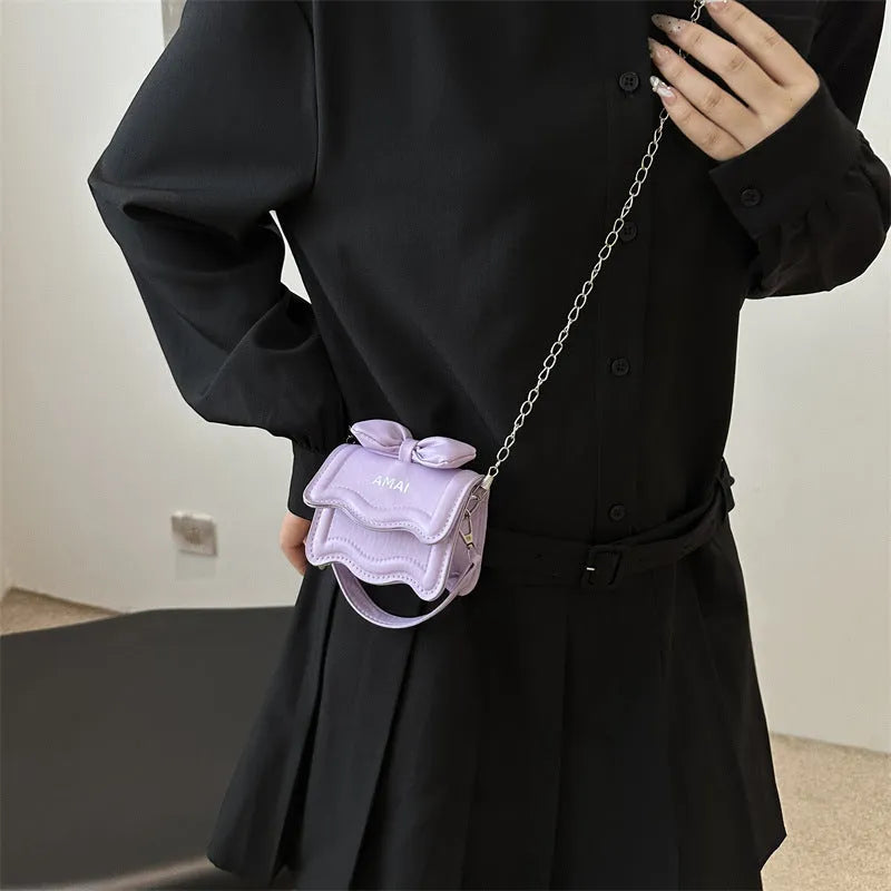 Mini crossbody bag in black, PU material, single shoulder strap, compact size for women