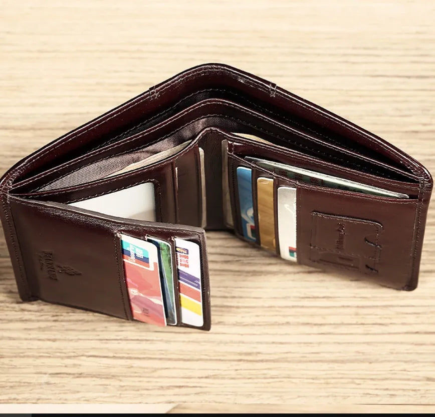 Men's black leather wallet open to show internal compartments for banknotes, cards, coins, and a concealed dark space.