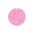 Round silicone pet licking mat with suction cup base in blue, on a kitchen tile floor.