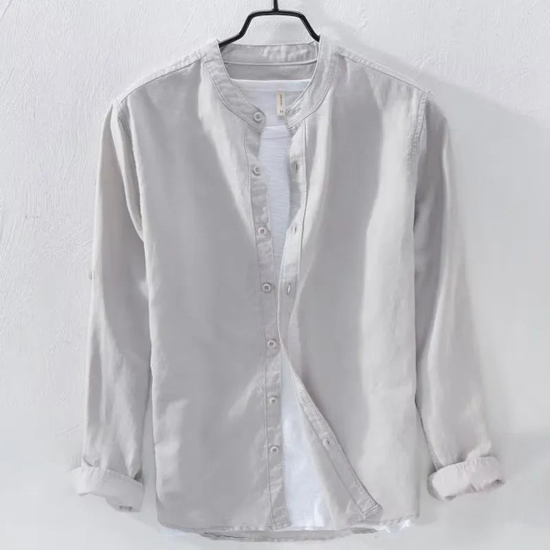 Man's loose-fit long sleeve casual shirt in linen-cotton blend, shown in dark blue colour.