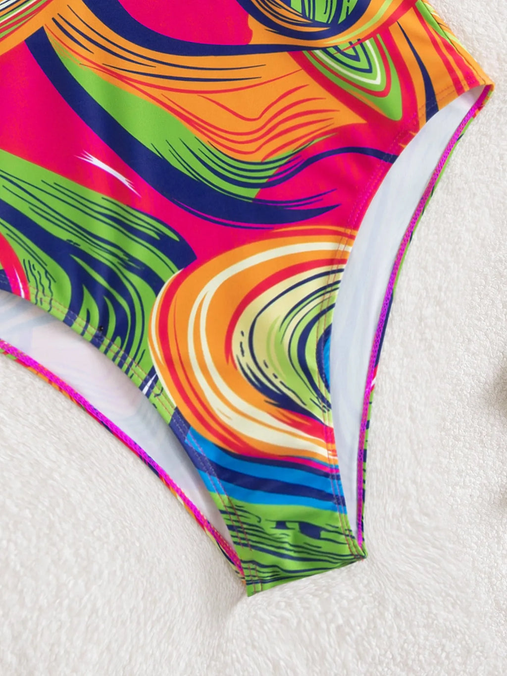 Women's deep V spaghetti strap one-piece swimsuit in polyester with printed pattern, available in multiple colours