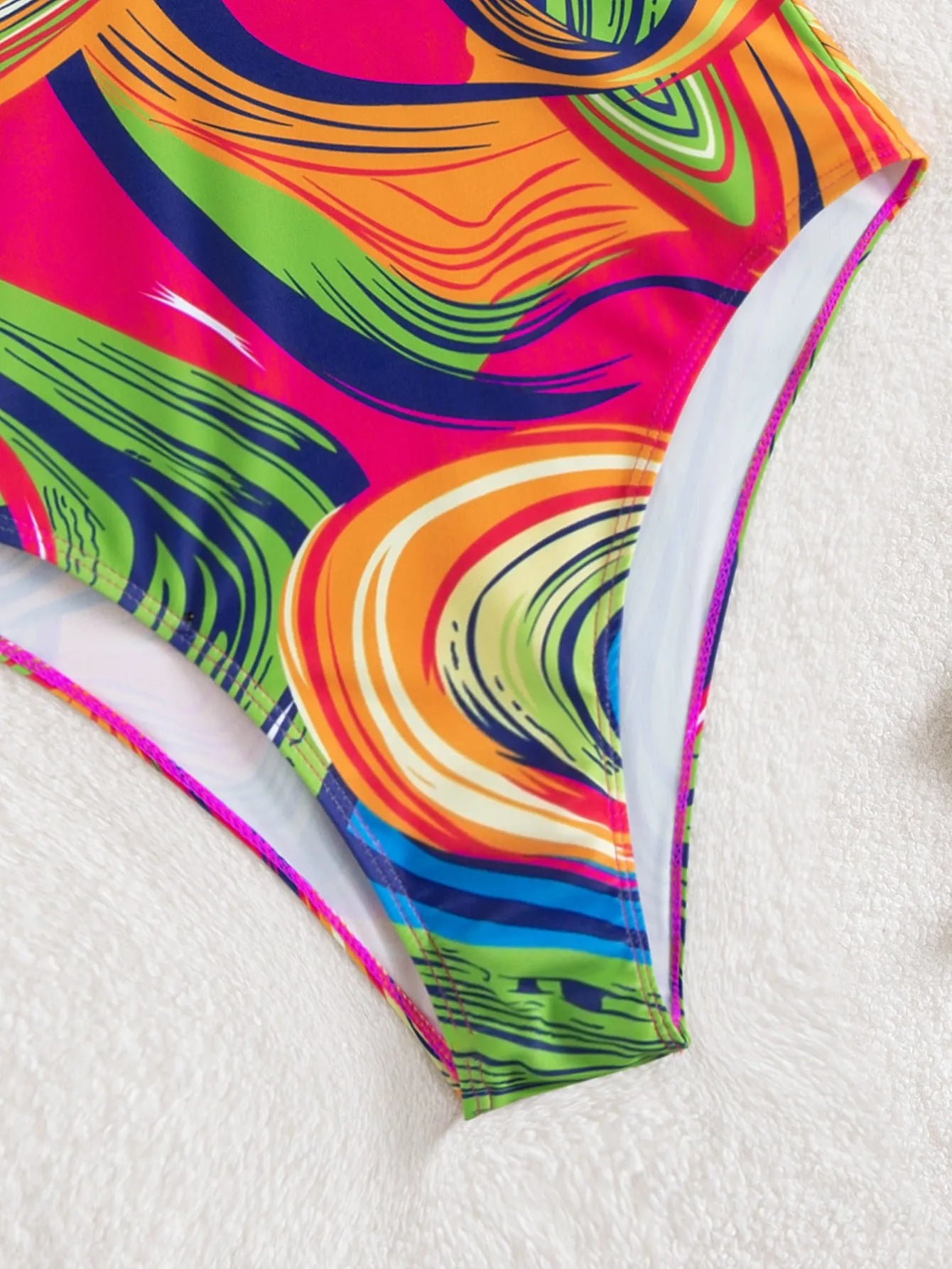 Women's deep V spaghetti strap one-piece swimsuit in polyester with printed pattern, available in multiple colours
