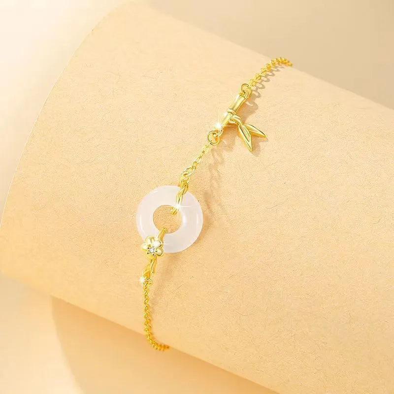 Silver white chalcedony bracelet with starry sky design and peace buckle on a neutral background