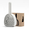 Plastic cat litter scoop with base in white model, showing hidden bag storage compartment and large scoop head with alternating apertures