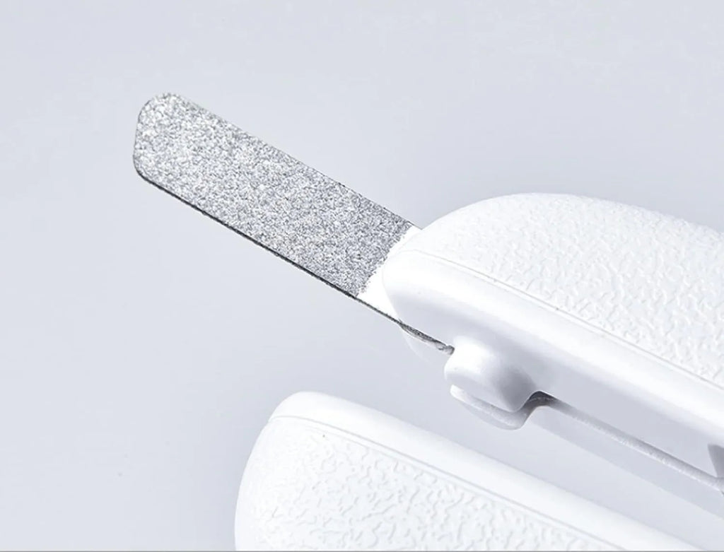 White pet nail clippers with LED light, triangular blade, and transparent anti-splash guard