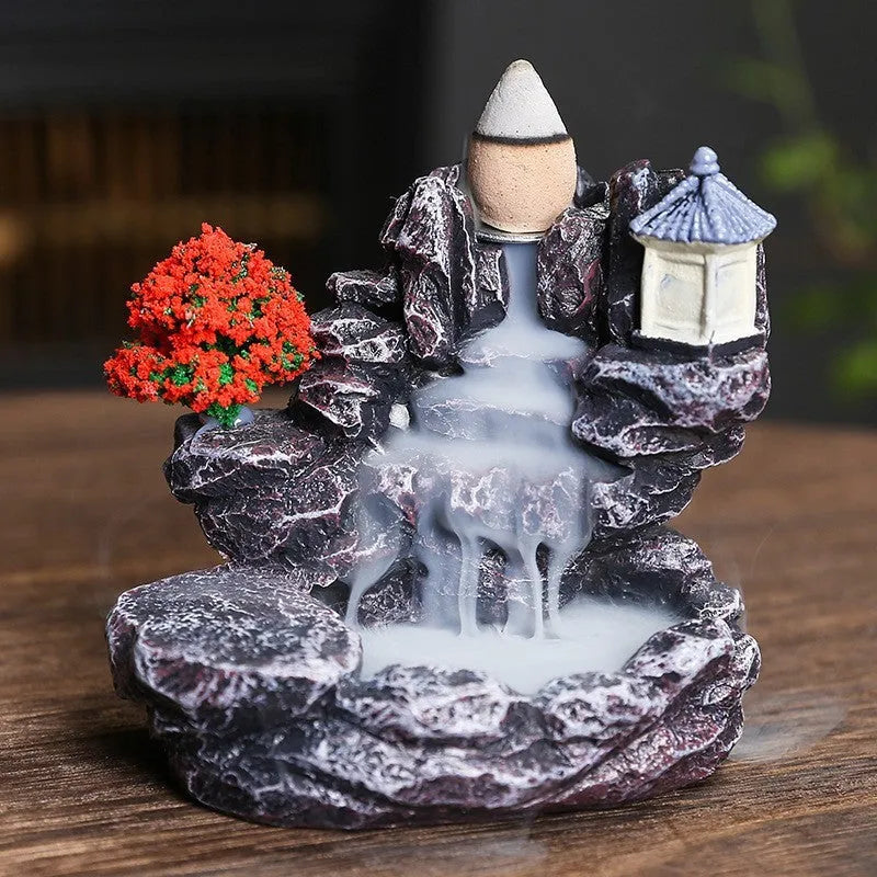 Creative ceramic backflow incense burner ornament in modern simplicity style with smoke cascading downwards