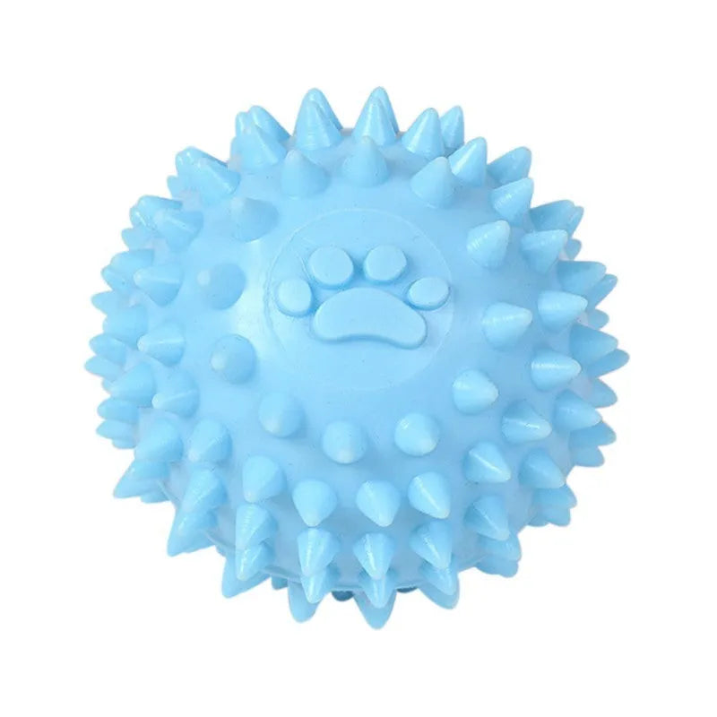 Close-up of 6cm TPR rubber dog chewing toy ball with footprint pattern in blue pink or yellow for tooth cleaning