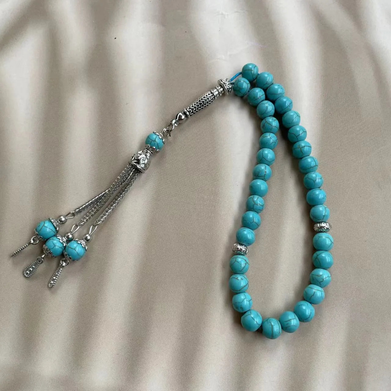 Handmade sky blue stone Muslim prayer bracelet with 8mm beads on a string.