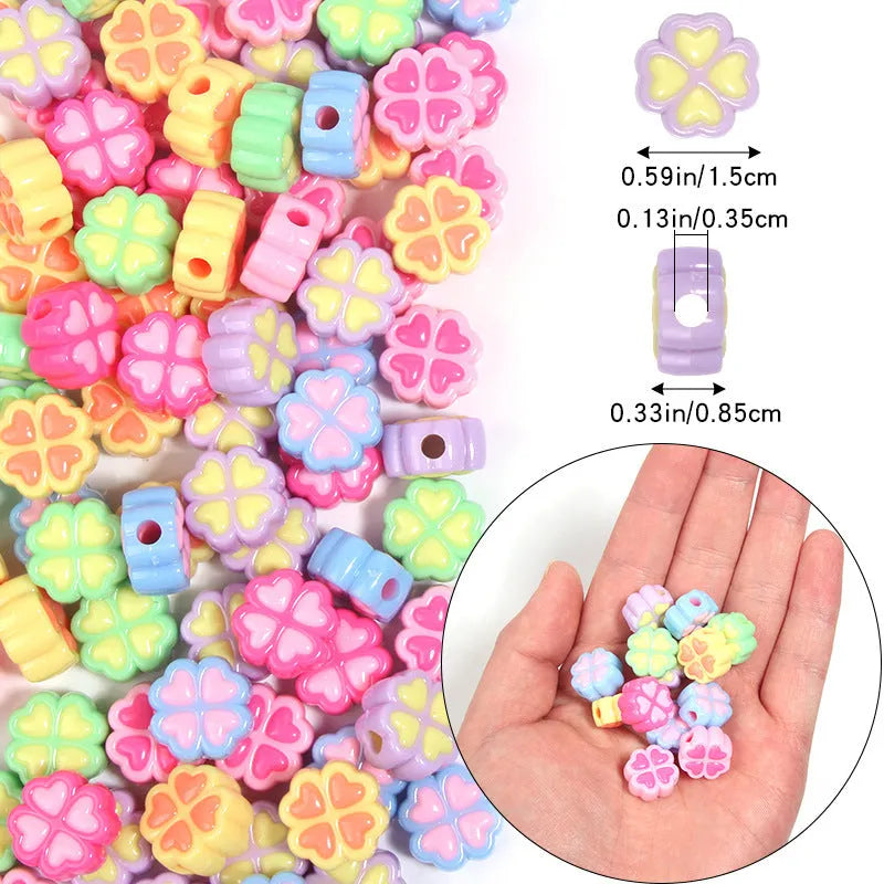 Acrylic four-leaf clover craft beads with love pattern in mixed colours showing frosted finish