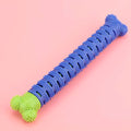 Blue-green silicone dog dental cleaning stick with textured surface and inner bristle core