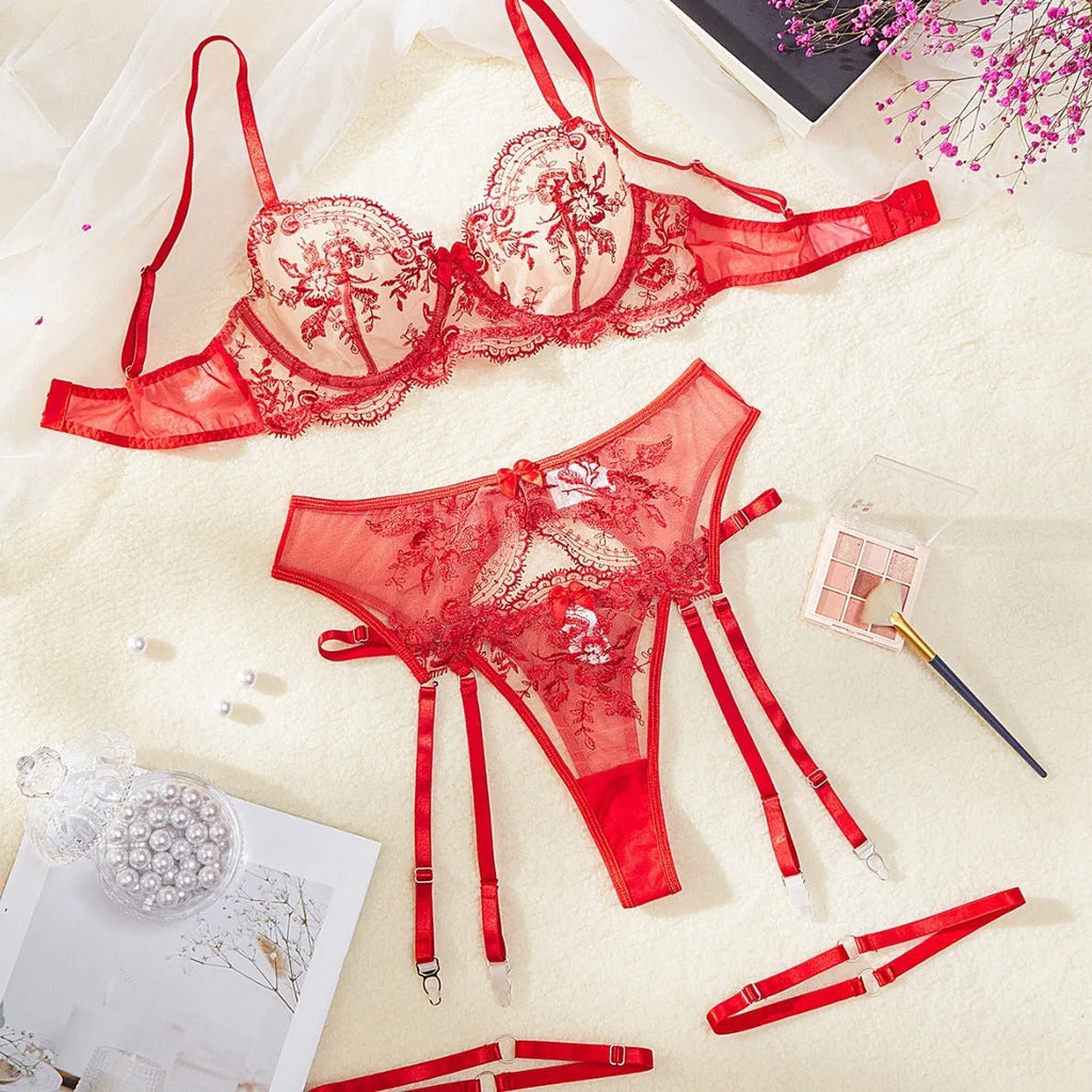 Women's see-through lingerie set with embroidery and cutout details in black polyester from front view
