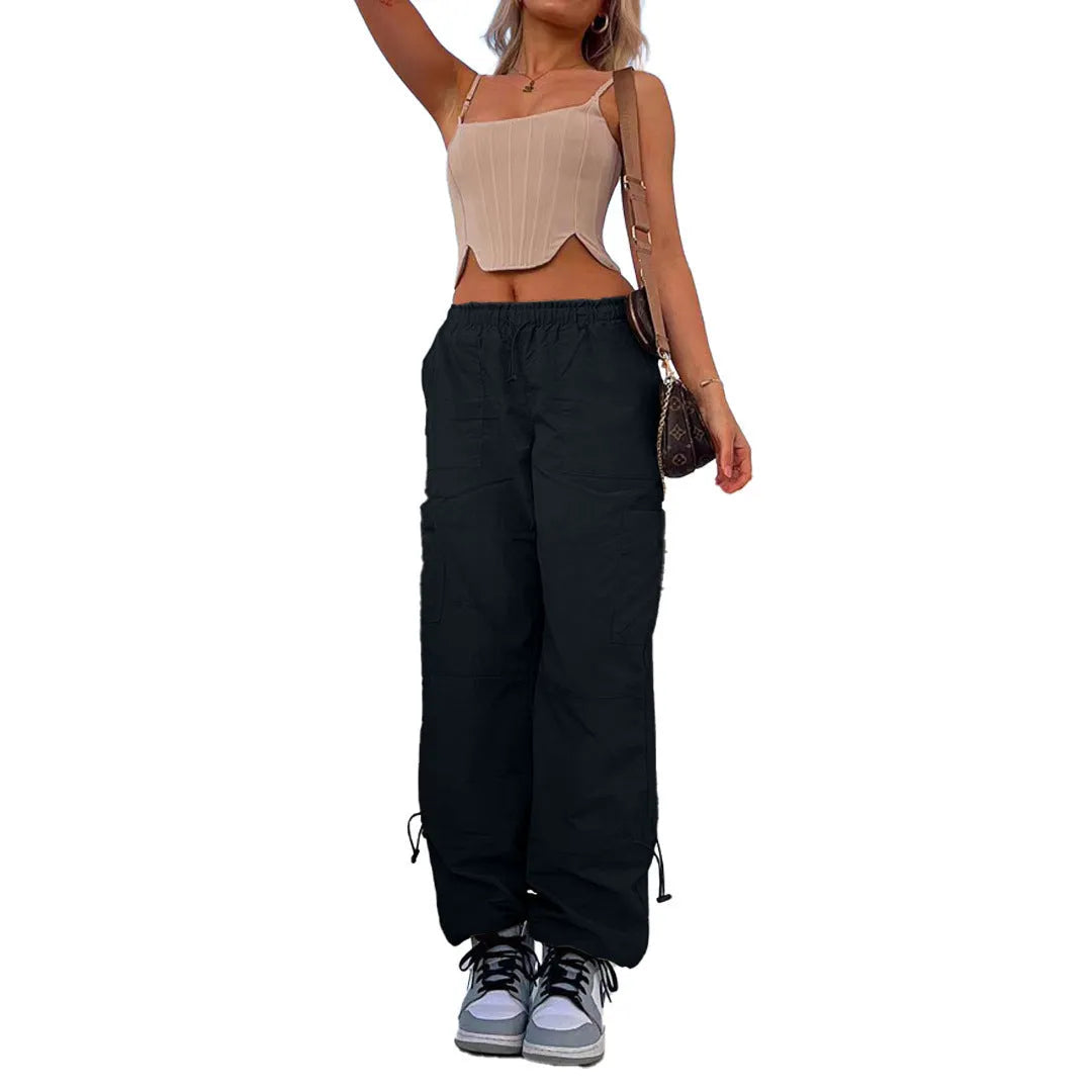 Loose-fit straight-leg cargo casual pants in grey with multiple pockets, shown on a hanger.