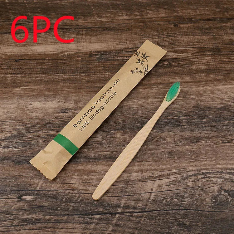 10 bamboo toothbrushes with soft charcoal bristles in assorted colours arranged fanned out