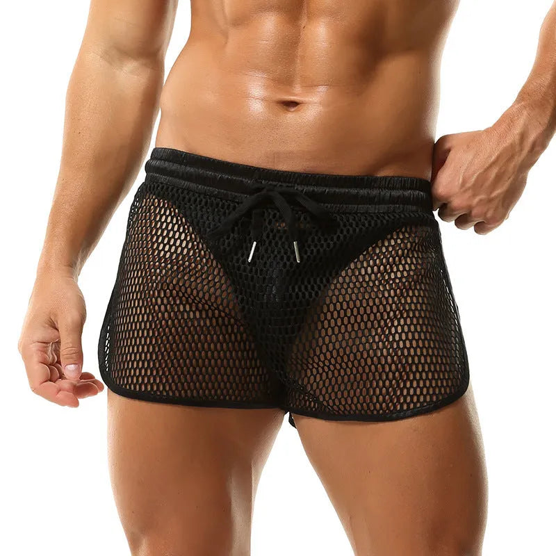 Men's loose breathable polyester boxers in solid colour black, front view on white background
