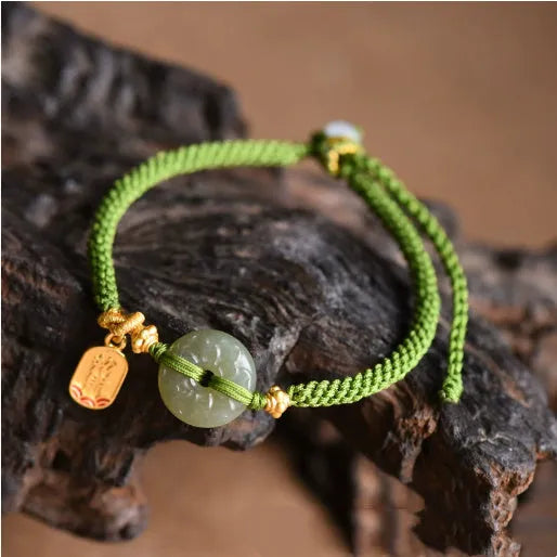 Hand-woven green rope bracelet with a Hetian jade safety buckle, adjustable sliding knot, women's National style accessory